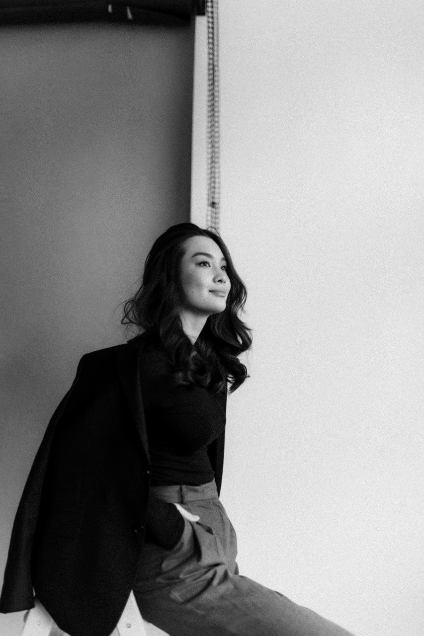 Black-and-white portrait of Lisa Li in a blazer