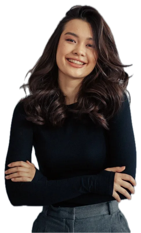 Lisa Li smiling with her arms crossed, in a black top